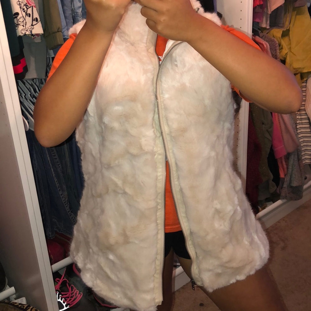 a cream white vest